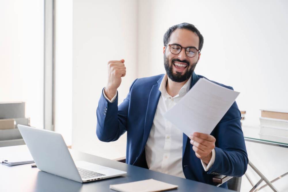 Business owner celebrating an approved loan