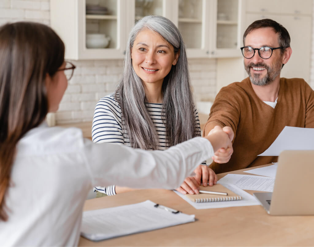 Business owners closing a funding deal with their advisor
